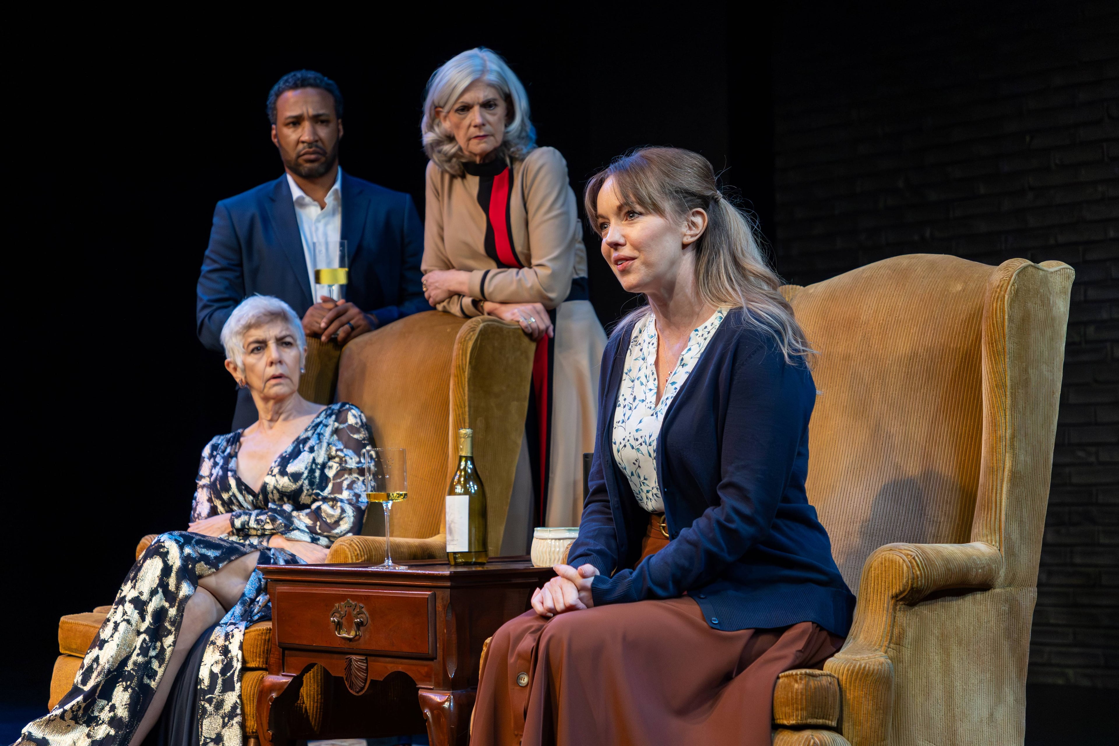 From left, Linda (Mary Lynn Owen), Jerry (Christopher Hampton ) and Sylvia (Kathleen Wattis Kettrey) listen to Hilda (Bethany Anne Lind) spin unsettling stories from her life. (Photo by Casey Gardner Ford)