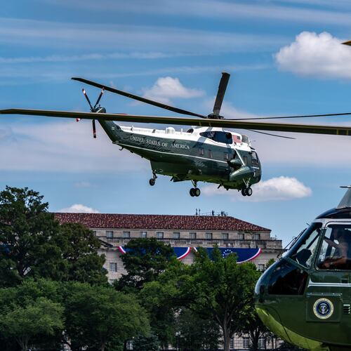 Marine One, left, with President Donald Trump aboard, lifts off from the Ellipse, Tuesday, Aug. 4, 2026, in Washington. (AP Photo/Alex Brandon)