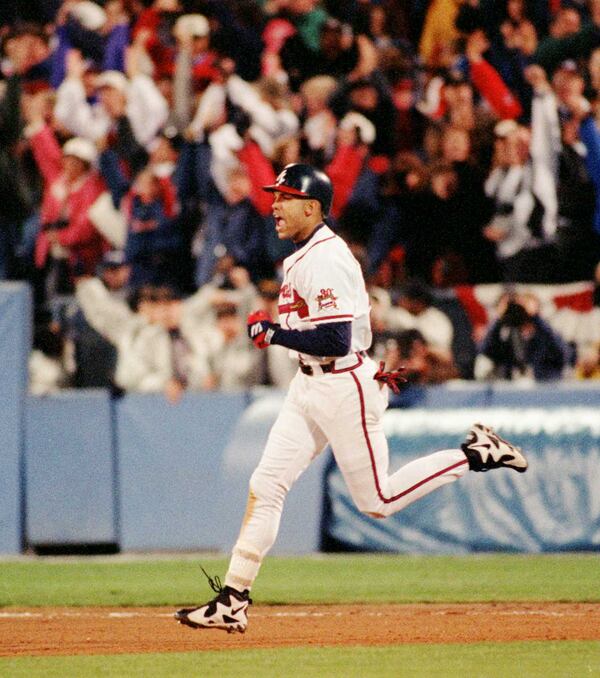Atlanta Braves right fielder David Justice yells as he rounds the bases after his solo homer in the sixth inning of Game Six of the World Series at Atlanta Fulton County Stadium, Saturday. Oct. 28, 1995. (AP Photo/Mark Duncan)