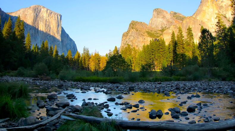 Sunrise in Yosemite Valley looking onto El Capitan and Cathedral Rocks. Courtesy of MacGillivray Freeman Films. Photographer: Barbara MacGillivray