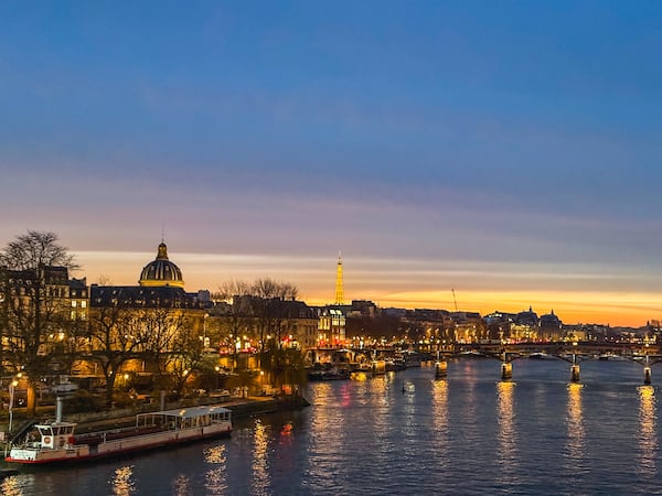 A view of Paris from the Pont Neuf bridge looking over the Seine toward the Eiffel Tower.