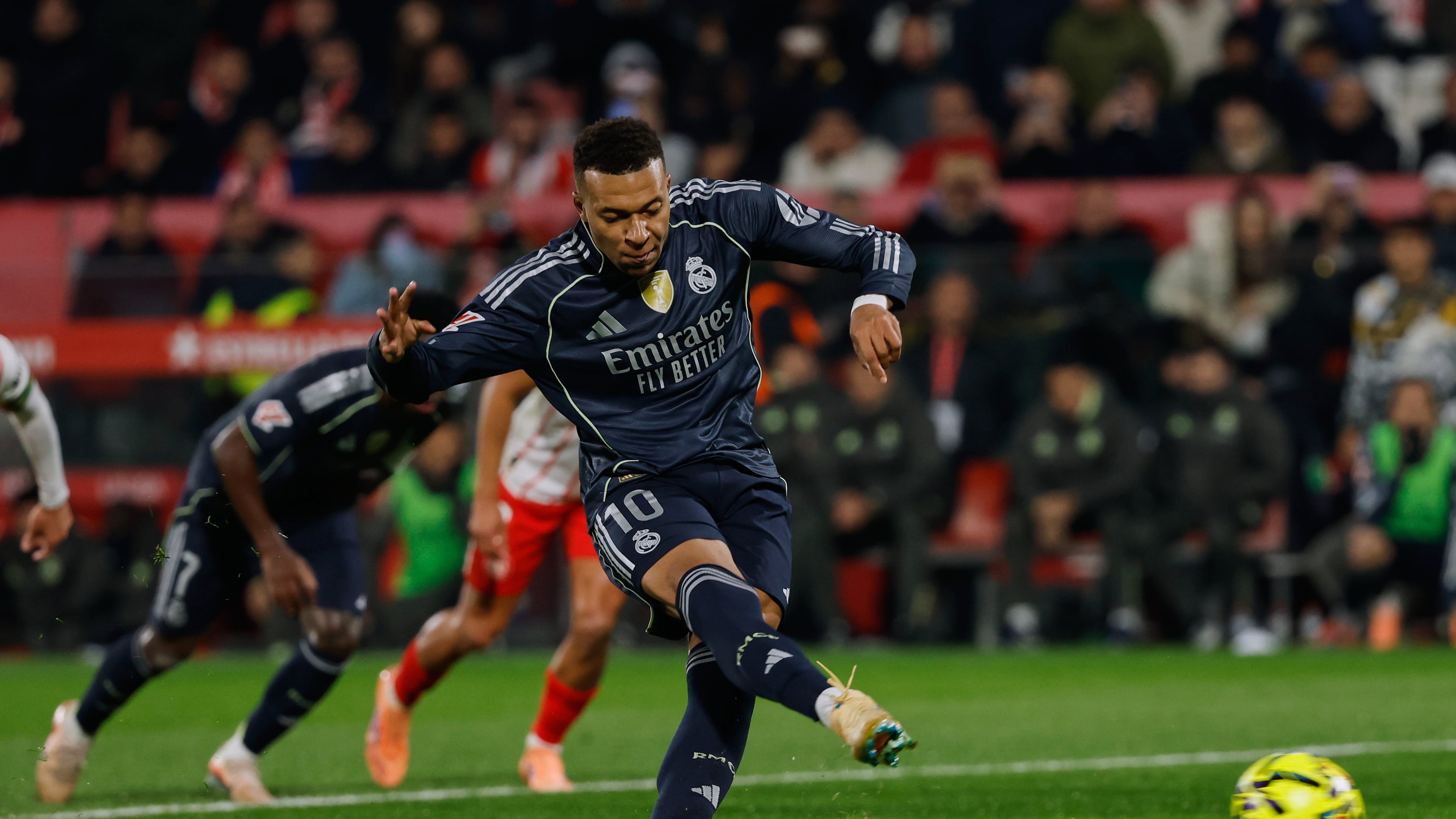 Real Madrid's Kylian Mbappe scores a penalty kick during a Spanish La Liga soccer match between Girona and Real Madrid, in Girona, Spain, Sunday, Nov. 30, 2025. (AP Photo/Joan Monfort)