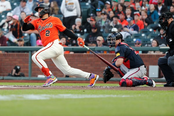 San Francisco Giants shortstop Willy Adames (2) singles against the Atlanta Braves in the first inning of a baseball game at Oracle Park in San Francisco, Friday, June 6, 2025. (Santiago Mejia/San Francisco Chronicle via AP)