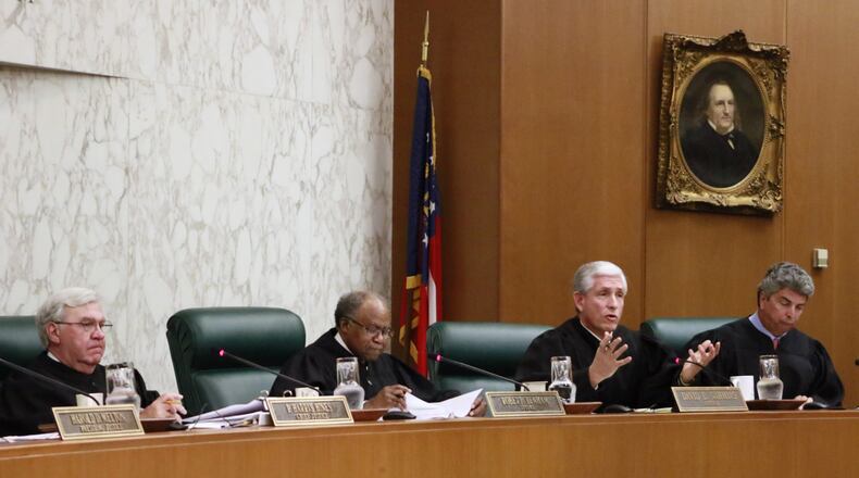 Georgia Supreme Court Justice David Nahmias (second from right), asked whether tax credits are really government money, in a lawsuit involving a $58 million state-authorized program that subsidizes private schools, many of them religious. Plaintiffs argue that’s a violation of the separation of church and state mandate in the state constitution. BOB ANDRES /BANDRES@AJC.COM