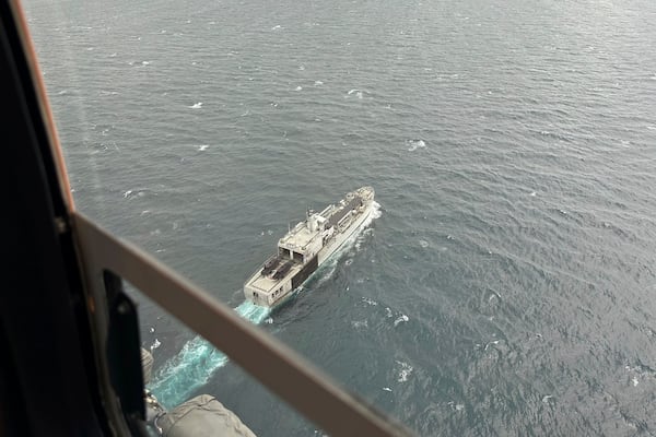 Indonesian Navy ship KRI Teluk Ende cruises the Straits of Bali during a search operation for the victims of a late Wednesday ferry sinking near Bali, Indonesia, Friday, July 4, 2025. (AP Photo/Firdia Lisnawati)