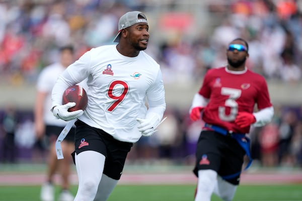 FILE - AFC tight end Jonnu Smith (9), of the Miami Dolphins, carries the ball against the NFC during the flag football event at the NFL Pro Bowl Games on Sunday, Feb. 2, 2025, in Orlando, Fla. (Doug Benc/AP Images for NFL, file)