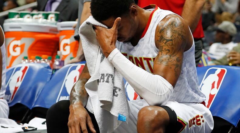 Atlanta Hawks forward Kent Bazemore (24) sits on the bench during a timeout in the second half of an NBA basketball game against the Detroit Pistons, Friday, Dec. 2, 2016, in Atlanta. (AP Photo/John Bazemore)
