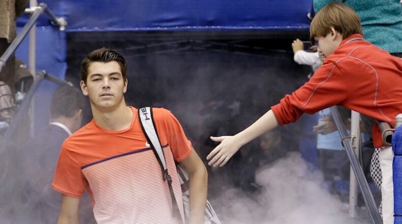 Taylor Fritz of the United States enters the court for the singles championship against Kei Nishikori of Japan at the Memphis Open tennis tournament Sunday, Feb. 14, 2016, in Memphis, Tenn. (AP Photo/Mark Humphrey)