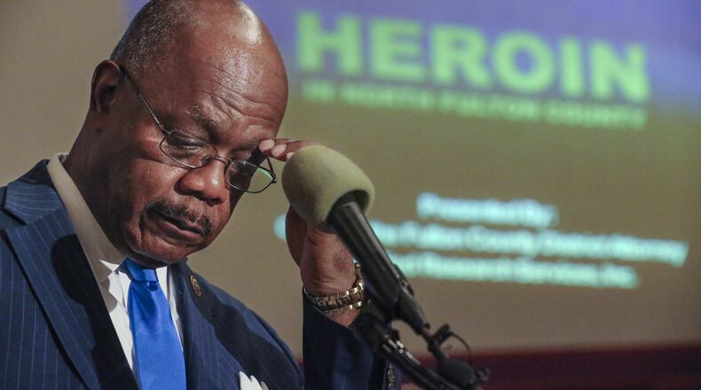 Fulton County District Attorney Paul Howard looks over his notes before releasing the findings of a study on the heroin crisis in Fulton County in this file photo from Friday, Jan.15, 2016.