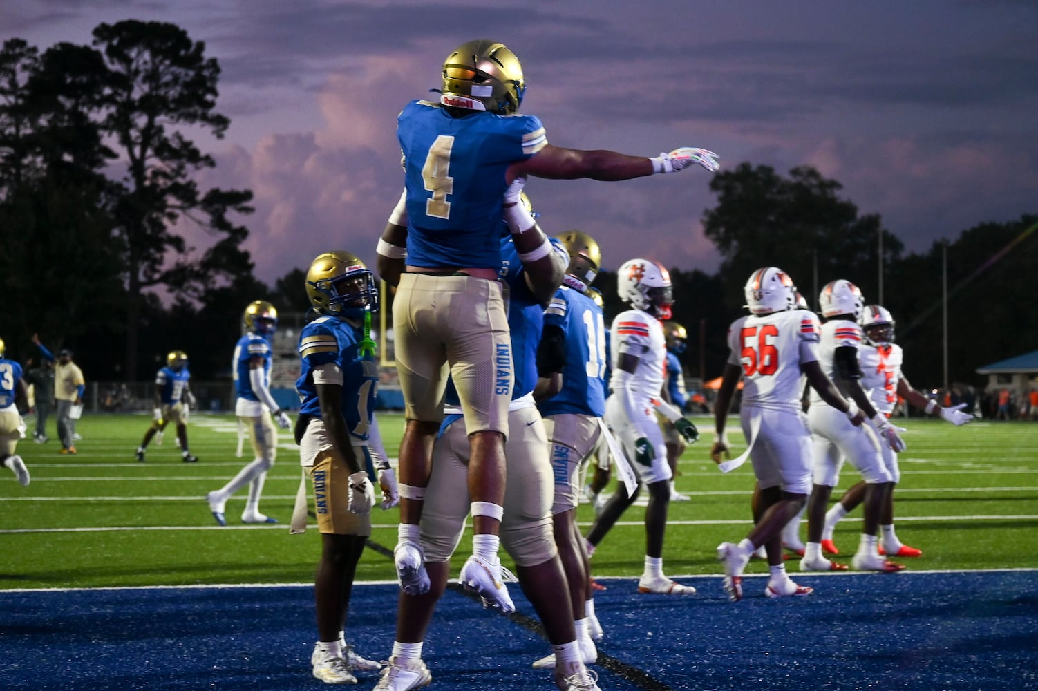 McEachern running back Henry Pullen (4) celebrates his touchdown against North Cobb during the first half of play Friday, August 22, 2025 at McEachern.  (Daniel Varnado/For the Atlanta Journal-Constitution)