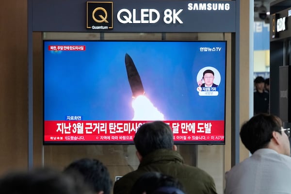A TV screen shows a file image of North Korea's missile launch during a news program at Seoul Railway Station in Seoul, South Korea, Thursday, May 8, 2025. (AP Photo/Ahn Young-joon)