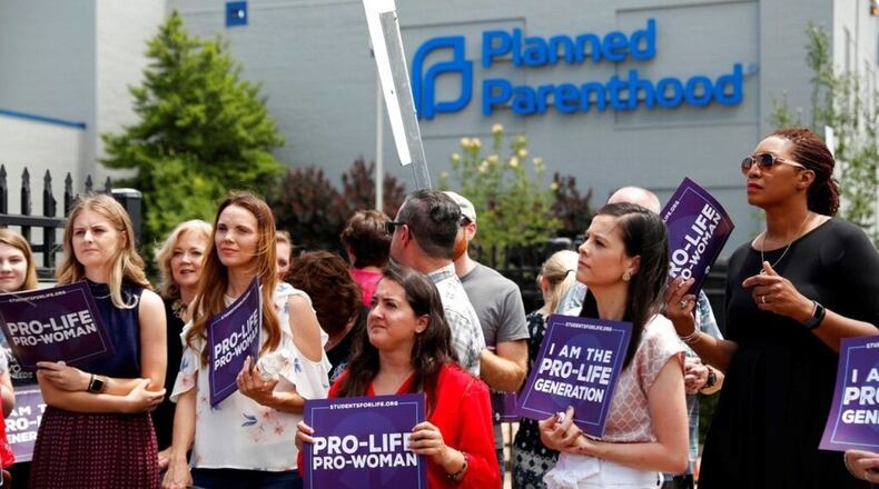 In this file photo, Anti-abortion advocates gather outside the Planned Parenthood clinic in St. Louis.