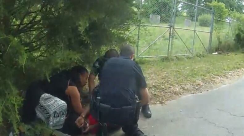 A group of bystanders helped an officer apprehend a suspect who was trying to escape a traffic stop Sunday evening in northwest Atlanta, police said