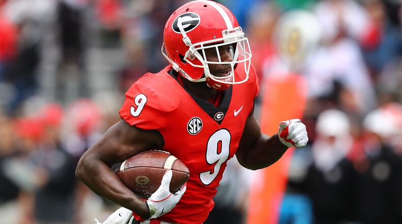 Georgia wide receiver Jeremiah Holloman breaks away for a touchdown after the reception during the annual G-Day football game on Saturday, April 20, 2019, in Athens.    Curtis Compton/ccompton@ajc.com