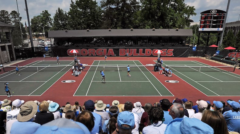 FILE - Spectators crowd center court at the Dan Magill Tennis Complex during the UCLA and North Carolina women's doubles match in the NCAA Division I tennis championships, May 20, 2014, in Athens, Ga. (AP Photo/David Tulis, File)