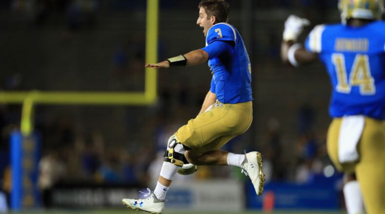 UCLA quarterback Josh Rosen exults after throwing a touchdown to Jordan Lasley late in the fourth quarter of Sunday's college football game.