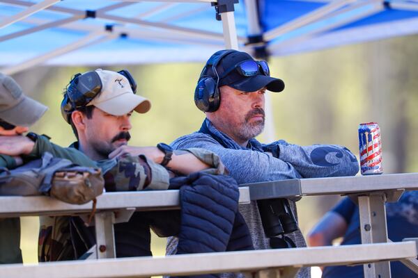 (Second L-R) Irish Defence Forces Cpl. Connor Thornton and retired Sgt. Alan Ferguson watch the International Sniper Competition at Fort Benning near Columbus on April 8, 2026. (Arvin Temkar/AJC)