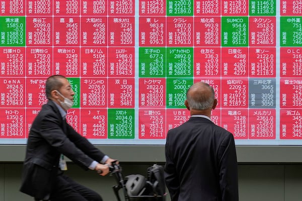 A person looks at an electronic stock board showing Japan's Nikkei index at a securities firm Monday, May 26, 2025, in Tokyo. (AP Photo/Eugene Hoshiko)