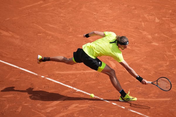 Germany's Alexander Zverev reaches for the ball as he plays Italy's Flavio Cobolli during their third round match of the French Tennis Open, at the Roland-Garros stadium, in Paris, Saturday, May 31, 2025. (AP Photo/Christophe Ena)