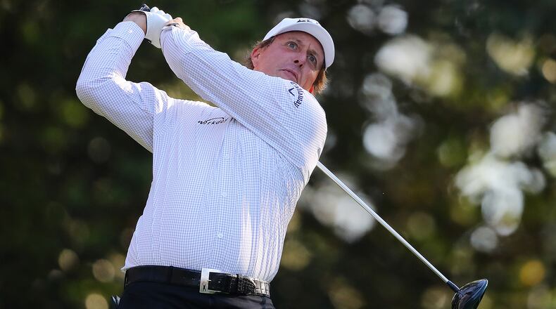 Phil Mickelson tees off on the 11th hole during his practice round at Augusta National Golf Club on Tuesday, April 3, 2018, in Augusta. Curtis Compton/ccompton@ajc.com