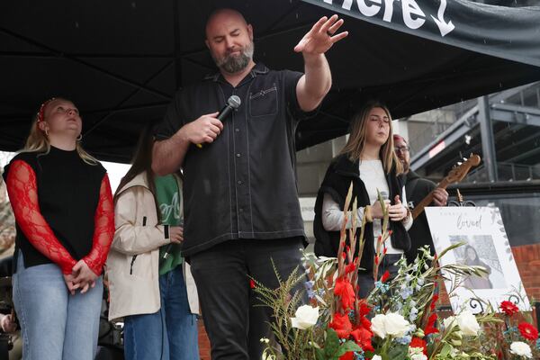 Derek Anglin, lead pastor of NewGrace Church in Commerce, led a worship service at UGA on Saturday at a memorial for Laken Riley, who was murdered on campus in 2024. (C.J. Bartunek for the AJC)