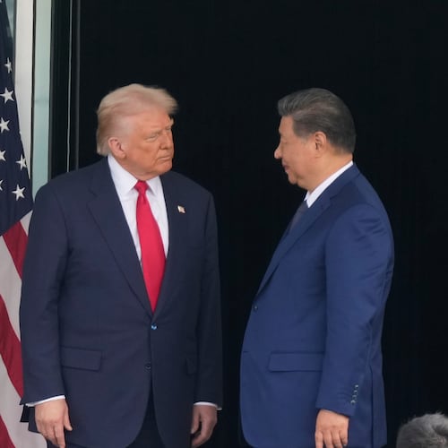 President Donald Trump, left, and Chinese President Xi Jinping, look at each other after their summit meeting at Gimhae International Airport Jinping in Busan, South Korea, Thursday, Oct. 30, 2025. (AP Photo/Mark Schiefelbein)