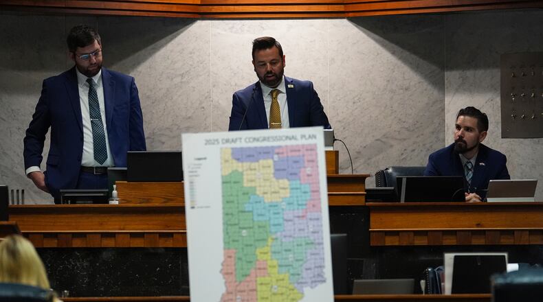 Indiana Lt. Gov. Micah Beckwith announces the results of a vote to redistrict the state's congressional map, Thursday, Dec. 11, 2025, at the Statehouse in Indianapolis. (AP Photo/Michael Conroy)