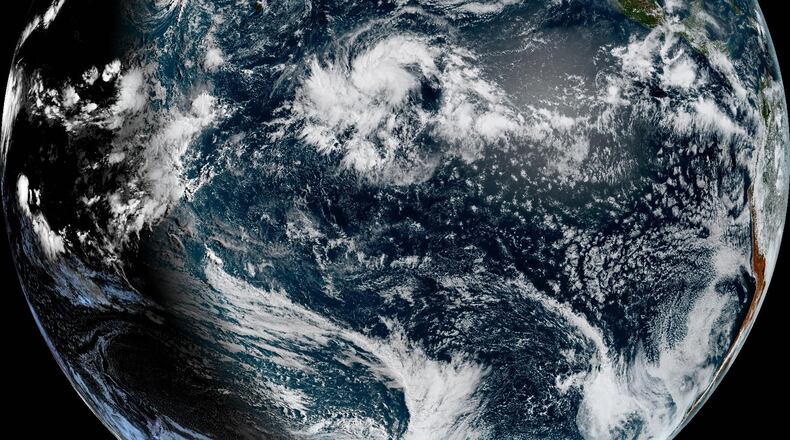 This satellite image provided by NOAA shows Hurricane Lala on Wednesday, Aug. 19, 2026, in the Pacific Ocean northeast of Hawaii. (NOAA via AP)