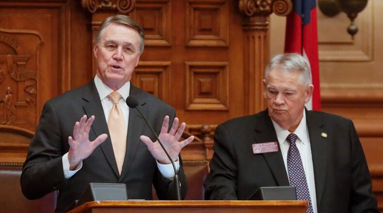 March 2, 2020 - Atlanta - Georgia Senator David Perdue, standing with House Speaker David Ralston, addresses the house after qualifying for a second term as the general assembly continued for the 22nd legislative day. Bob Andres / robert.andres@ajc.com