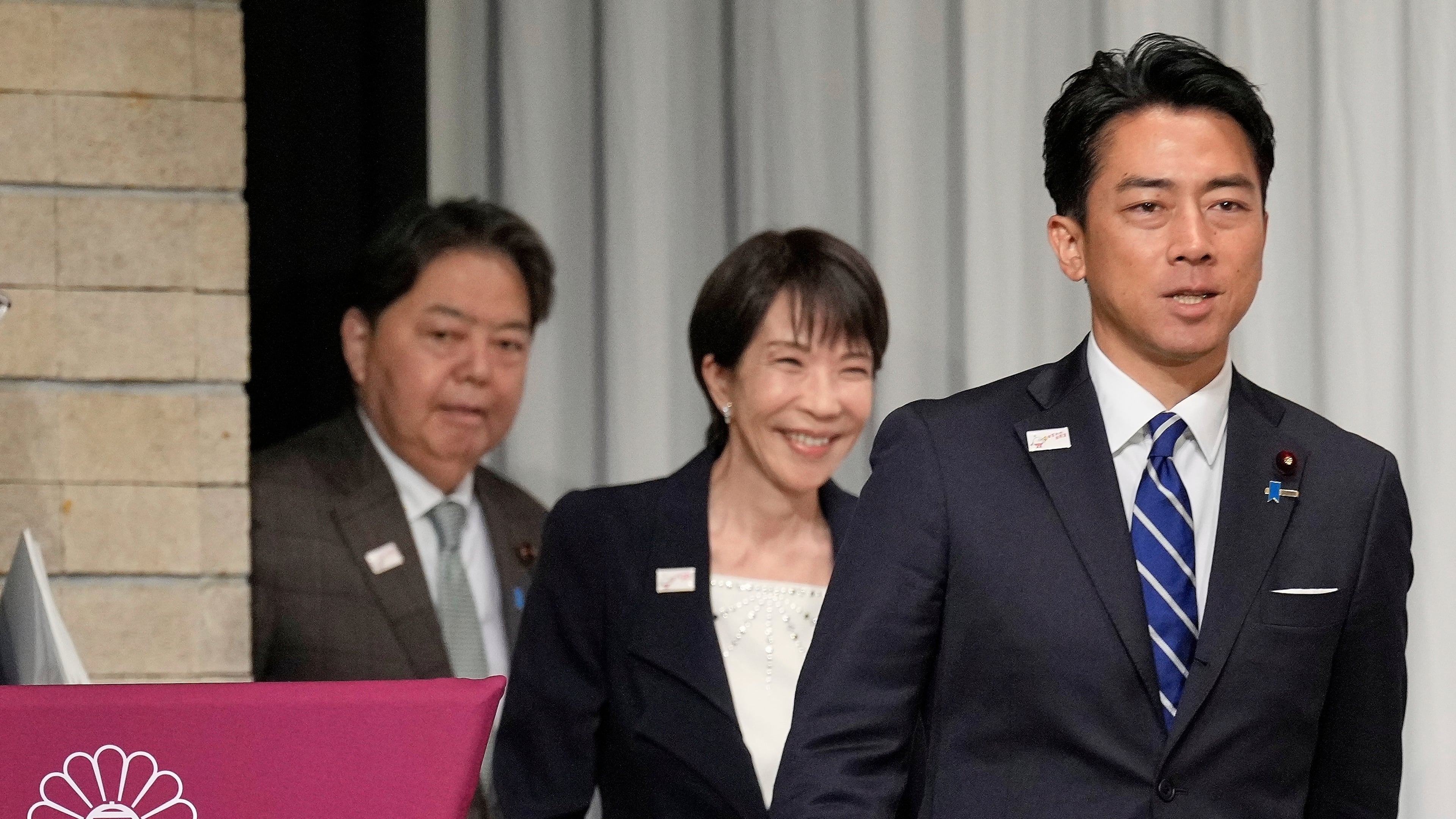 FILE - From left, Japan's chief Cabinet Secretary Yoshimasa Hayashi, former Economic Security Minister Sanae Takaichi and Agriculture Minister Shinjiro Koizumi walk into the stage for a joint press conference by the Liberal Democratic Party (LDP) presidential election candidates at the party's headquarters Tuesday, Sept. 23, 2025, in Tokyo. (AP Photo/Eugene Hoshiko, Pool, File)