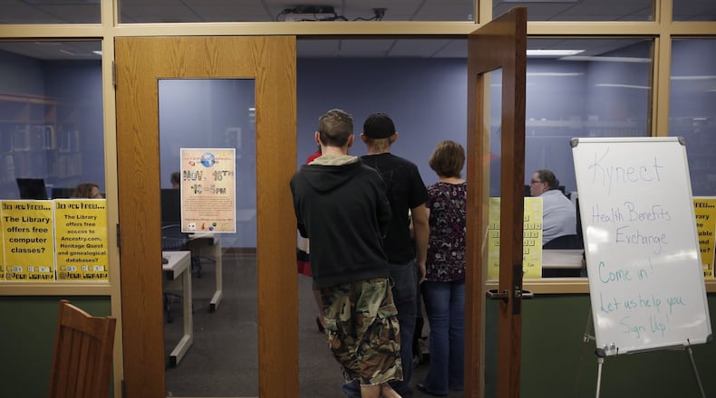 Attendees line up an Affordable Care Act open enrollment event at a public library in La Grange, Ky., Oct. 21 2013. Compared to the struggling federally-run exchange, Kynect has been a success, enrolling a reported 1,000 Kentuckians a day, and officials credit a well-funded outreach program and an extensively-tested website for the smooth rollout. (Luke Sharrett/The New York Times)