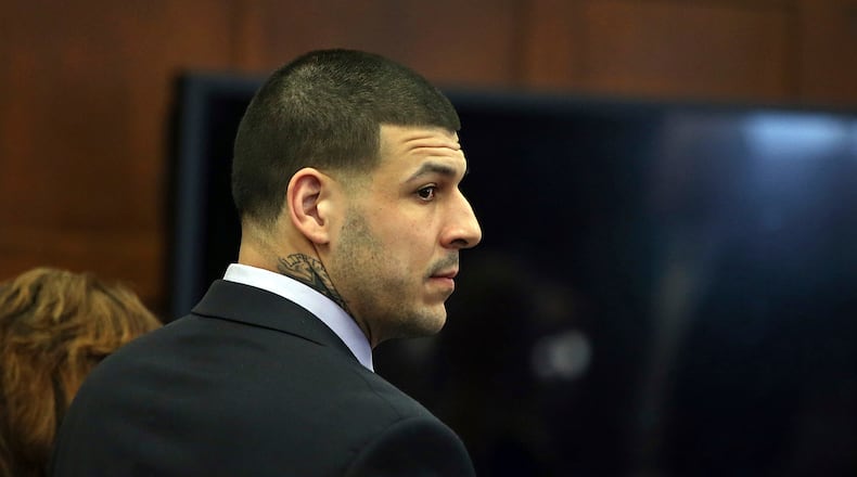 Former New England Patriots tight end Aaron Hernandez stands at the defense table when court is adjourned without a verdict on day five of jury deliberations in his double murder trial at Suffolk Superior Court on Thursday, April 13, 2017. Hernandez is standing trial for the July 2012 killings of Daniel de Abreu and Safiro Furtado who he encountered in a Boston nightclub. The former NFL player is already serving a life sentence in the 2013 killing of semi-professional football player Odin Lloyd.