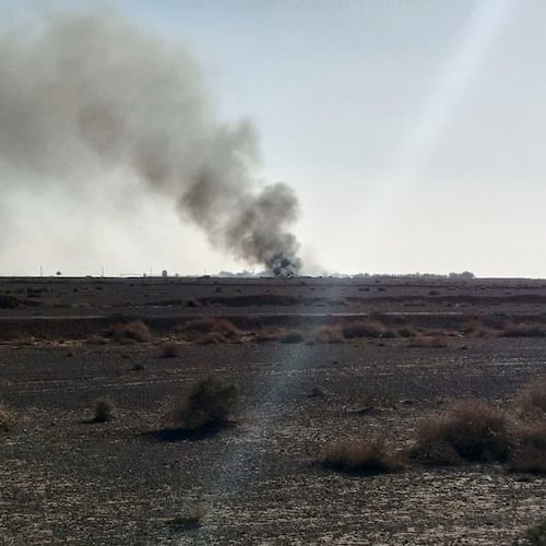 In this image provided by Sepahnews, the Iranian Revolutionary Guard's official website, black smoke rises into the air at what Iran's state TV claimed was the site where an American transport plane and two helicopters involved in a rescue operation were shot down, in Isfahan province, Iran, April, 2026. (Sepahnews via AP)