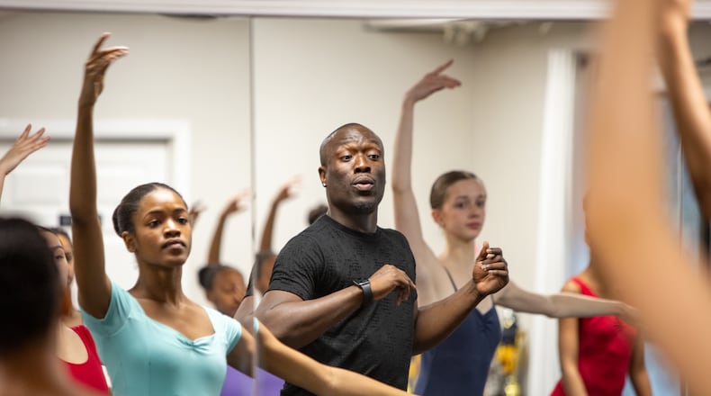 The Namari Dance Center in Sandy Springs is the home to approximately 50 dance students and is where owner and director Antwan Sessions watches for proper posture with the older students at the center. The center will travel to Africa for a collaboration performance in July 2025. (Jenni Girtman for the Atlanta Journal-Constitution)