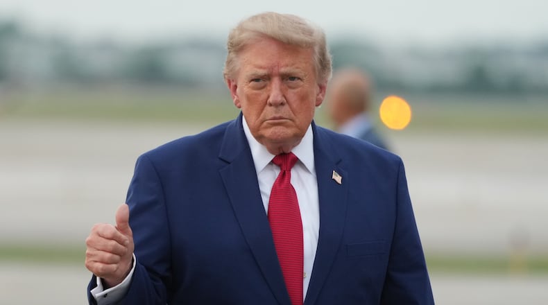 President Donald Trump walks from Marine One to board Air Force One at Cleveland Hopkins International Airport in Cleveland, Tuesday, Aug. 11, 2026. (AP Photo/Mark Schiefelbein)
