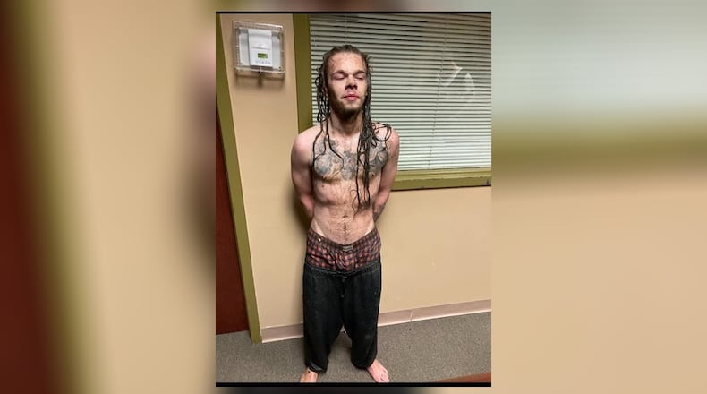 Justin Tyler Davenport is charged with murder after authorities said he fatally shot his stepfather Tuesday evening outside a Butts County Ingles.