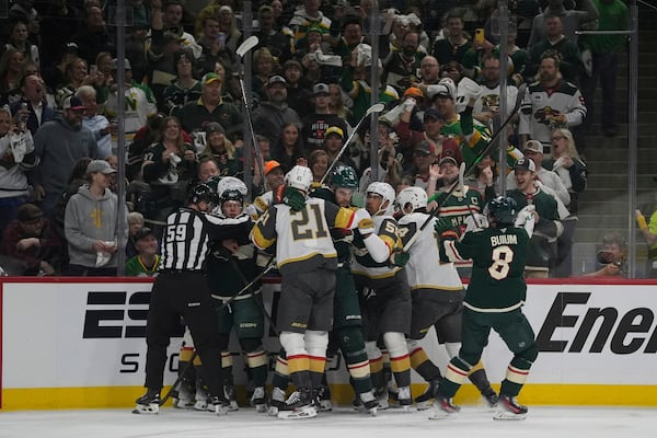 Minnesota Wild and Vegas Golden Knights players get into an altercation during the first period of Game 3 of a first-round NHL hockey playoff series Thursday, April 24, 2025, in St. Paul, Minn. (AP Photo/Abbie Parr)