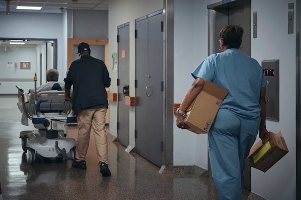 A nurse transports a patient on a stretcher inside Brookdale University Hospital and Medical Center on Tuesday, July 1, 2025, in the Brooklyn borough of New York. (AP Photo/Andres Kudacki)