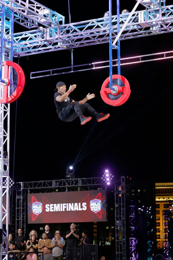 Flowery Branch resident Glenn Davis, age 61 when the show filmed in October, competes in the Ferris Wheel obstacle during the semifinals of "American Ninja Warrior." (Photo by Trae Patton/NBC)