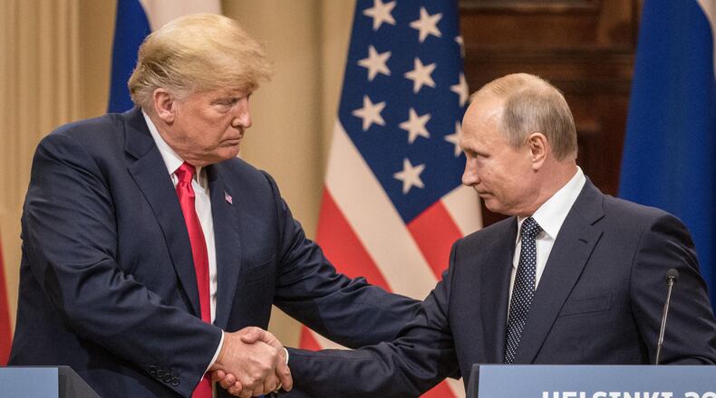 HELSINKI, FINLAND - JULY 16: U.S. President Donald Trump (L) and Russian President Vladimir Putin shake hands during a joint press conference after their summit on July 16, 2018 in Helsinki, Finland. The two leaders met one-on-one and discussed a range of issues including the 2016 U.S Election collusion.  (Photo by Chris McGrath/Getty Images)