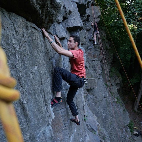 A man climbs on a cliff during the Stoned Climbers festival near Denyshi, Zhytomyr region, Ukraine, Saturday, June 27, 2026. (AP Photo/Evgeniy Maloletka)