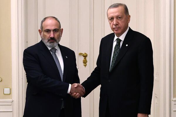 FILE - Turkey's President Recep Tayyip Erdogan, right, and Armenia's Prime Minister Nikol Pashinyan shake hands before a meeting at Prague Castle in Prague, Czech Republic, Thursday, Oct. 6, 2022. (Turkish Presidency via AP, file)