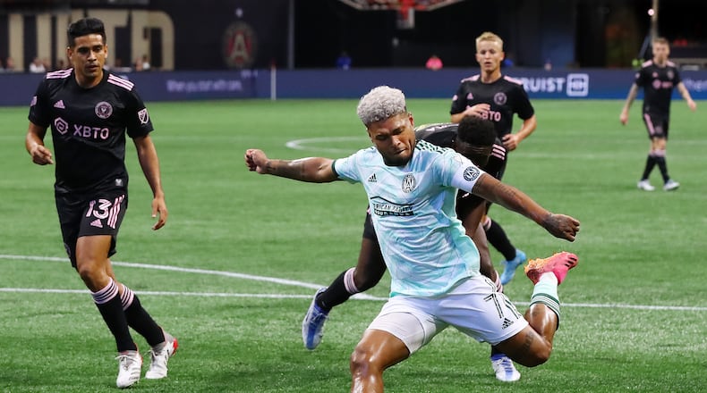061922 Atlanta: Atlanta United attacker Josef Martinez takes a shot on goal past Inter Miami defenders in a MLS soccer match on Sunday, June 19, 2022, in Atlanta.     “Curtis Compton / Curtis.Compton@ajc.com”