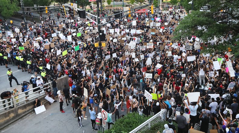 Thousands of protesters fill Marietta Street at Centennial Olympic Park Drive outside the CNN Center at Olympic Park during a fifth day of protests over the death of George Floyd (Curtis Compton ccompton@ajc.com)