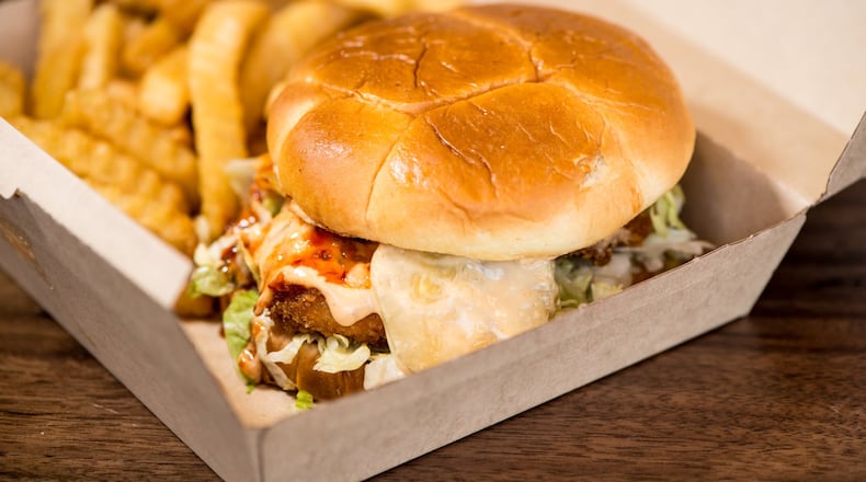 The Fussy Hussy is a plant-based patty with American cheese, shredded lettuce, onion, pickle and vegan mayo on a Hawaiian bun. Photo credit- Mia Yakel.