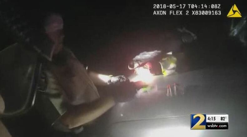 Coweta County deputies inspect material found in a car after a chase ended in a daycare playground.