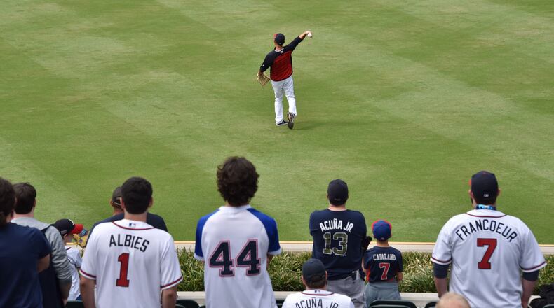 Atlanta Braves fans fill center field during the Braves' pregame warmups Wednesday, Oct. 9, 2019, at SunTrust Park in Atlanta.