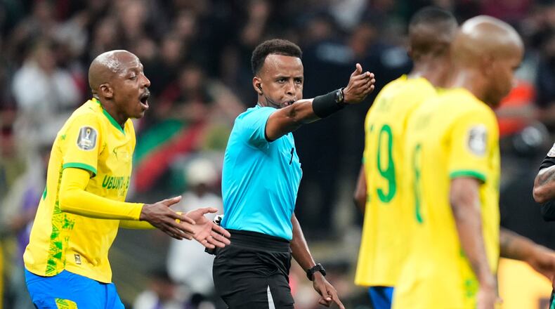 FILE - Referee Omar Artan, center, signals a penalty during the CAF Champions League final soccer match between AS FAR Rabat and Mamelodi Sundowns, in Rabat, Morocco, Sunday, May 24, 2026. (AP Photo/Mosa'ab Elshamy, File)