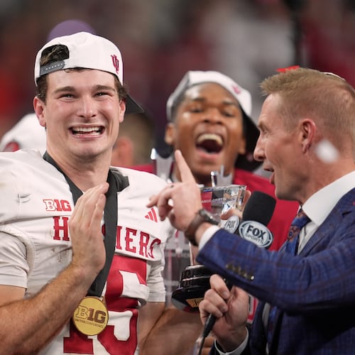 Indiana's Fernando Mendoza celebrates after after the Big Ten championship NCAA college football game against Ohio State in Indianapolis, Saturday, Dec. 6, 2025. (AP Photo/Michael Conroy)