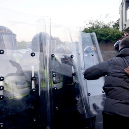 In this image taken from PA Video, police and protestors clash during a protest following the death of Henry Nowak, a 18-year-old student stabbed to death with a Sikh kirpan ceremonial by Vickrum Digwa, in Southampton, England, Tuesday June 2, 2026. (Jamie Lashmar/PA via AP)